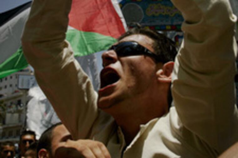 Palestinian Fatah supporters, chanting anti-Hamas slogans during a West Bank demonstration on Thursday.