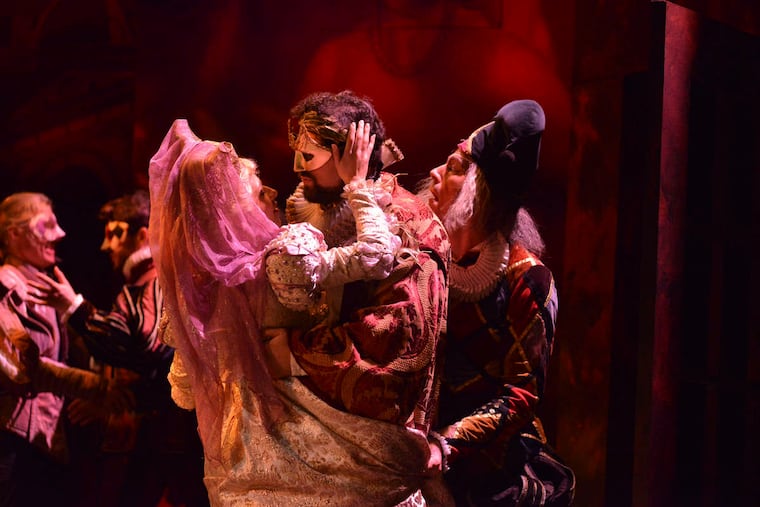 The Countess Ceprano (Alejandra Gomez) in the arms of the Duke of Mantua (Marco Cammarota) with Rigoletto (Jared Bybee) behind him in Academy of Vocal Arts’ production of Verdi’s Rigoletto
Credit: AVA/Paul Sirochman.