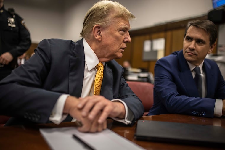 Donald Trump speaks with his attorney, Todd Blanche, before the start of the day’s proceedings during his criminal trial in New York, in 2024. Even as acting Attorney General, Blanche has never truly stopped serving as Trump’s personal attorney, writes the Editorial Board.