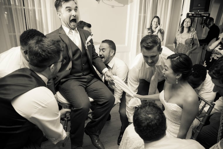 Jenny Lee and Jared Kubanoff as they are lifted in their chairs for the horah.