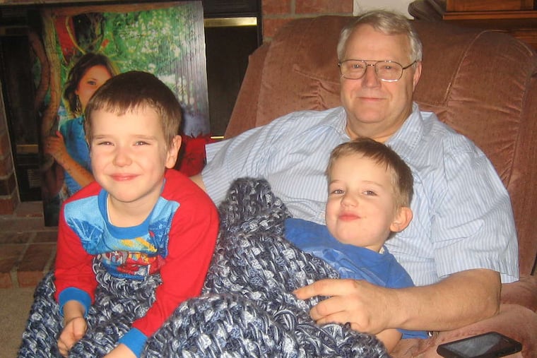 Chuck Cox sits with his grandchildren, Charlie (left) and Braden at the Coxes' home. The boys were killed by their dad, Josh Powell, who blew up his house during a court-ordered visit. Powell is shown, at left, with his missing wife, Susan.