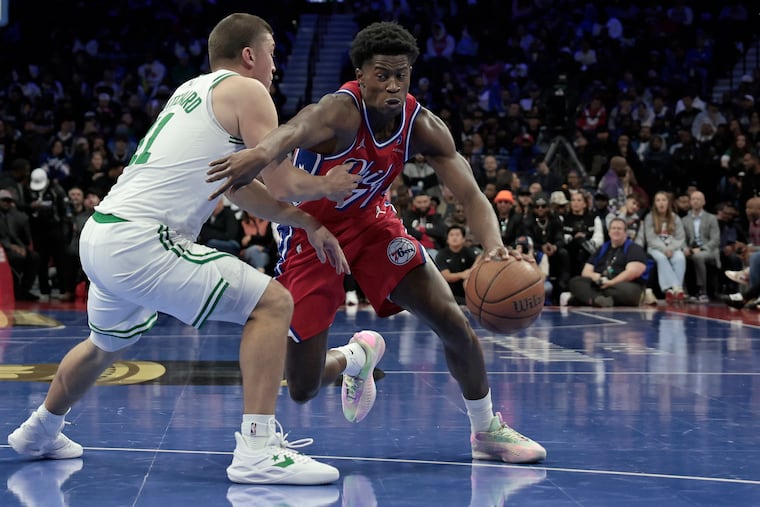 Sixers rookie VJ Edgecombe drives on Boston's Peyton Pritchard on Oct. 31.