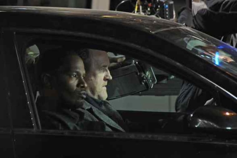 Jamie Foxx (left) and Colm Meaney hit the streets of Center City for "Law Abiding Citizen." The film also used an Overbrook Avenue house last week.