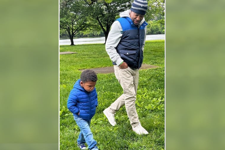 Phil Collins walks with his son, August. Collins has been on the kidney transplant list for the past two years.