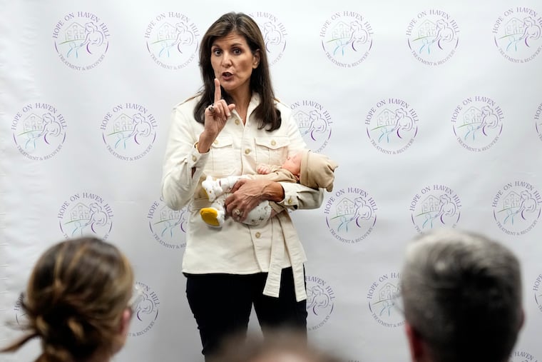 Republican presidential candidate and former U.N. Ambassador Nikki Haley holds a patient's baby while speaking at Hope on Haven Hill, a wellness center, Wednesday, Jan. 17, 2024, in Rochester, N.H.