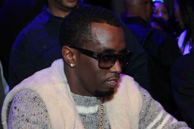Sean Combs ponders his bet at the blackjack table. Do I take a hit? Or do I stick?