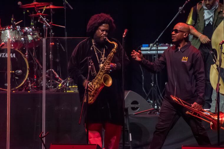 Kamasi Washington plays saxophone with his band while performing the warm up act for jazz great Herbie Hancock, at The Met in North Philadelphia, August 4, 2019. Avi Steinhardt / For the Inquirer