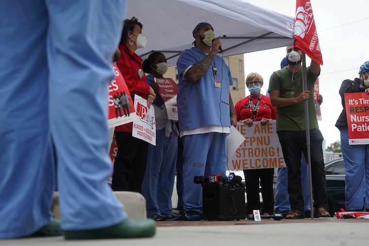 Carlos Aviles, a Pharmacy Tech-Technology Support Specialist, speaks at a PASNAP demonstration outside Temple University Hospital.