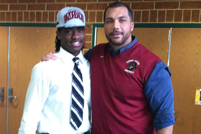 Cedar Creek QB Damon Mitchell and coach Tim Watson. (Phil Anastasia/Staff)