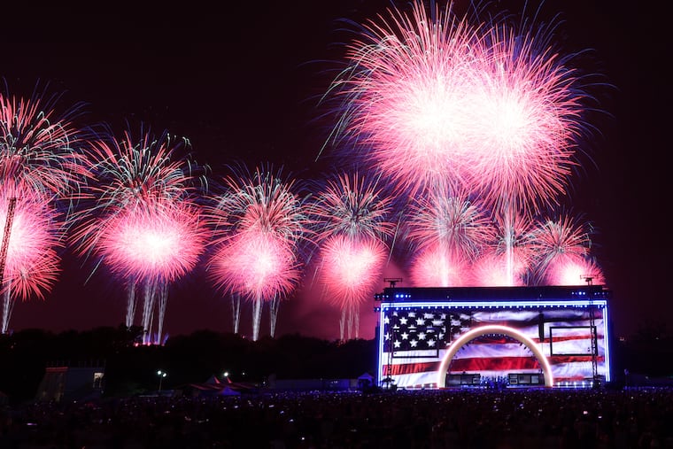 Fireworks boom behind the stage during the “Salute to America 250” celebration.