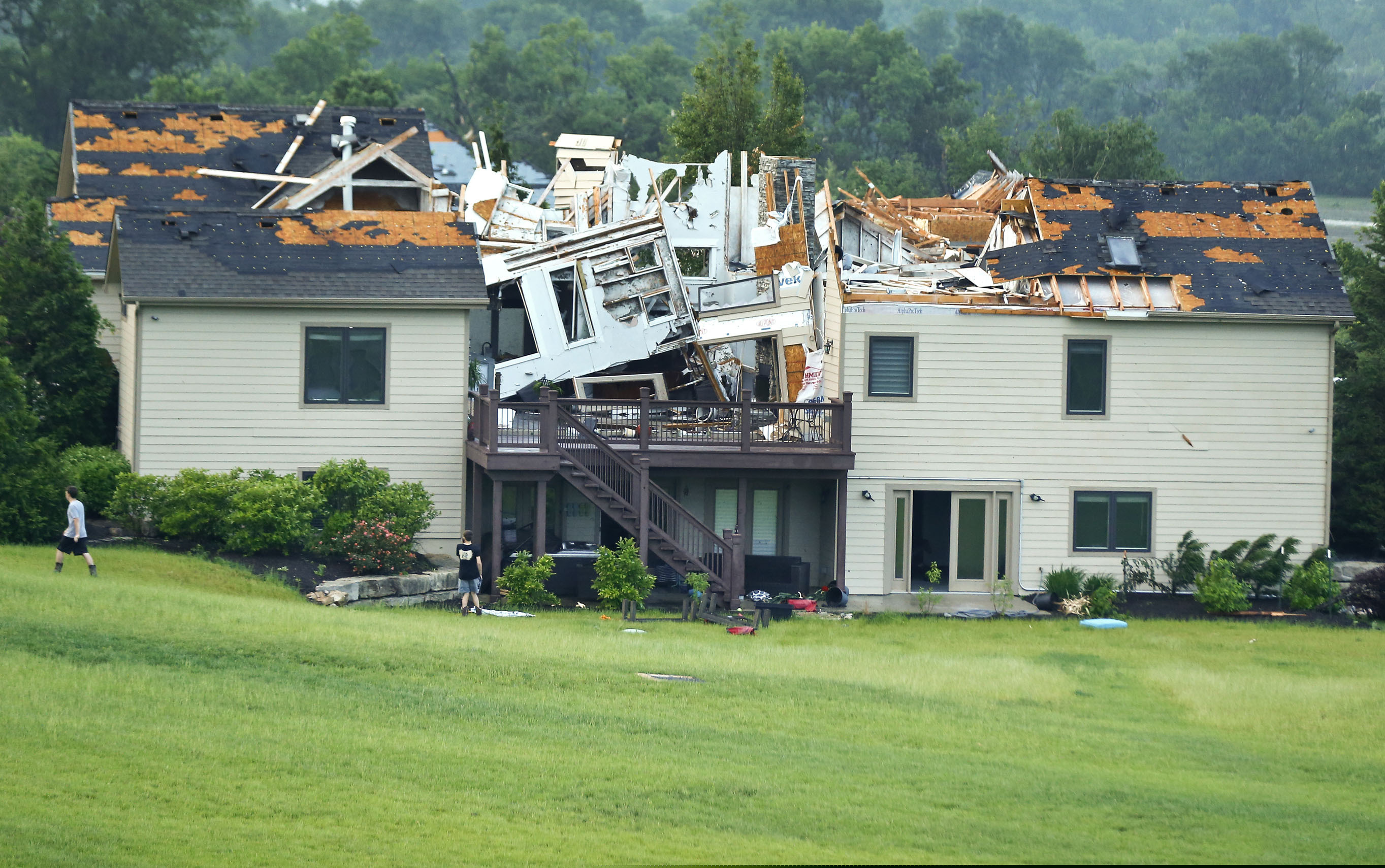 A destroyed home sits in a neighborhood after it was hit by a tornado on Tuesday, May 28, 2019, south of Lawrence, Kan., near US-59 highway and N. 1000 Road. The past couple of weeks have seen unusually high tornado activity in the U.S., with no immediate end to the pattern in sight.