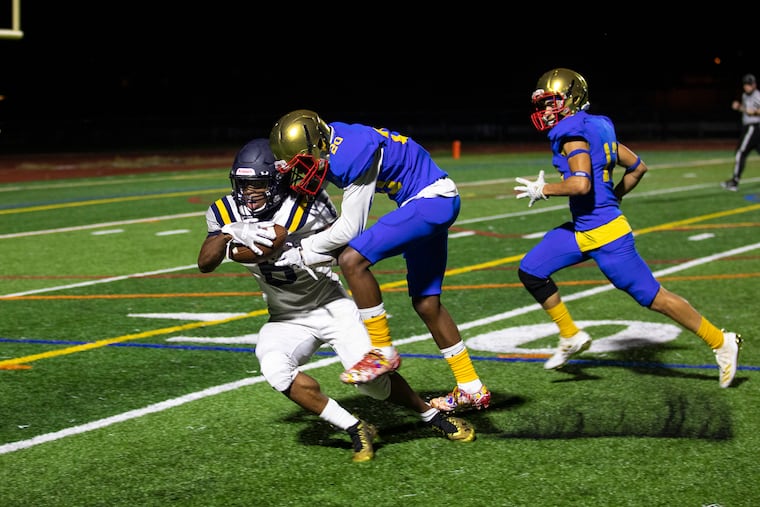 Cheltenham receiver Nate Edwards (6), catches the ball for a first down in the second half of the Panthers' 34-17 win over Frankford Thursday night at Northeast High.