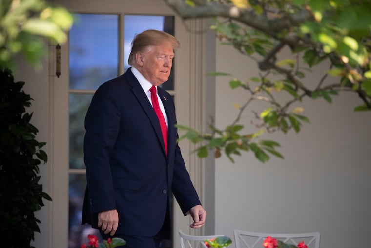 President Donald Trump arrives in the Rose Garden.