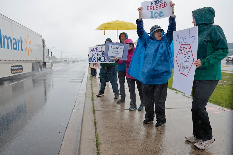 Protesters (from right) Gayle Gibson of Newark, Del.; Nancy Wahler of Wilmington; Michele and Reuben Yarmus of Wilmington; and Hadrian Cissell of Wilmington urge Avelo Airlines to end its contract to carry ICE deportees.