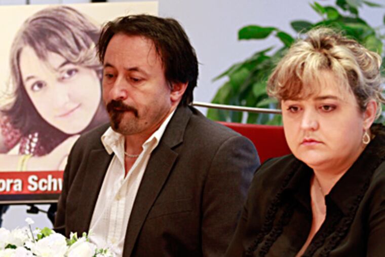 The parents of victim Dora Schwendtner, Peter Schwendtner and Aniko Takacs, participate Sunday in a news conference about the family's litigation for compensation over her death.