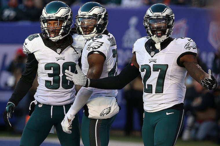 Malcolm Jenkins (right) is absent for the start of organized team activities.