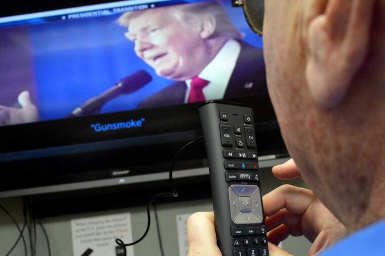 Resident Donald Crohe uses an Xfinity voice-activated remote control at Neshaminy Manor in Warrington, Pa.