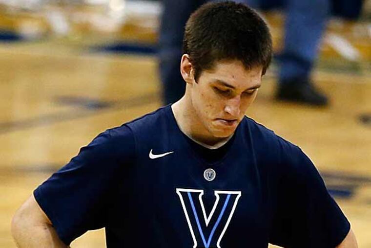 Villanova's Ryan Arcidiacono walks off the court as his team loses to Pittsburgh 73-64 in overtime. (Keith Srakocic/AP)