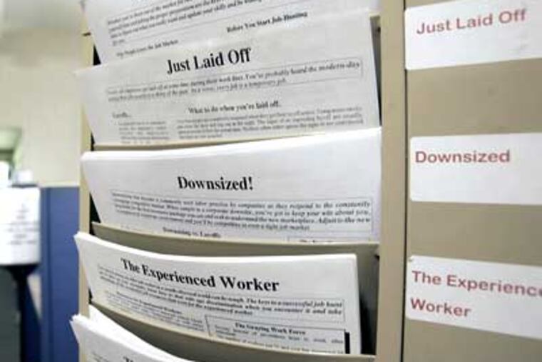 A rack with forms to assist the unemployed and job seekers is seen at a New York State Department of Labor career center in Albany, N.Y. The government says new claims for unemployment benefits reached their highest level in 26 years last week, as companies cut workers at a rapid pace. (Mike Groll/AP Photo, File)