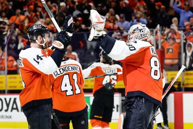 Flyers goaltender Dan Vladař celebrates after a historic performance in Game 6 against the Penguins.