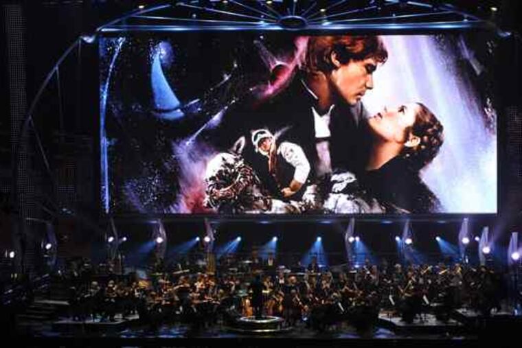 A 100-foot LED screen shows a scene from "Episode V - The Empire Strikes Back" before an 86- piece orchestra.