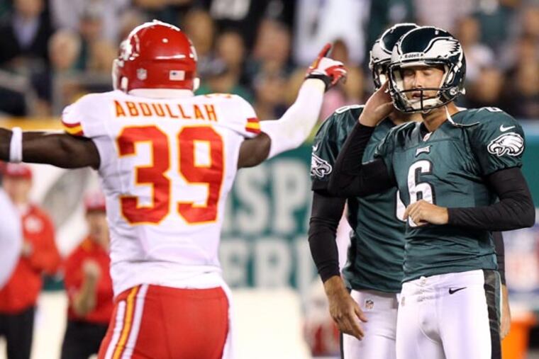 Alex Henery closes his eyes after missing a third quarter field goal attempt. (Yong Kim/Staff Photographer)
