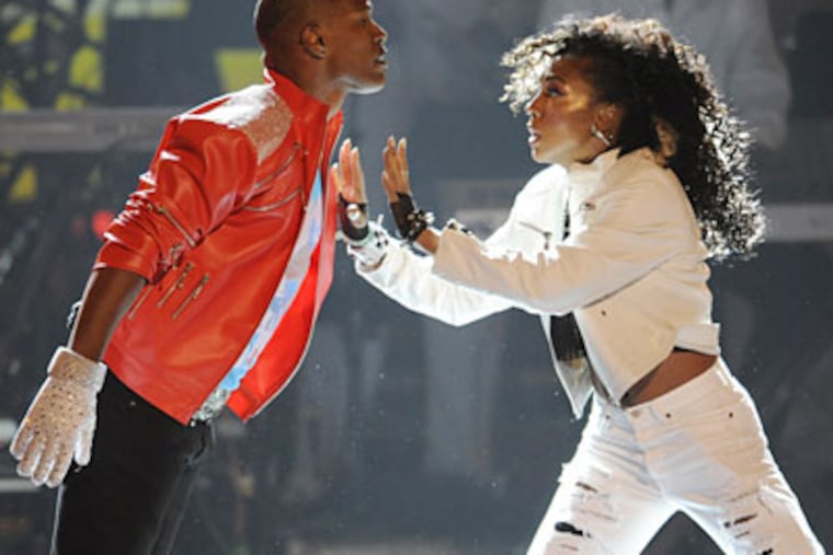 Jamie Foxx and a dancer in a homage to Michael Jackson at the BET Awards. Foxx, the host, offered a monologue wearing the red leather zipper jacket and glove in the Jackson style. (CHRIS PIZZELLO / AP)