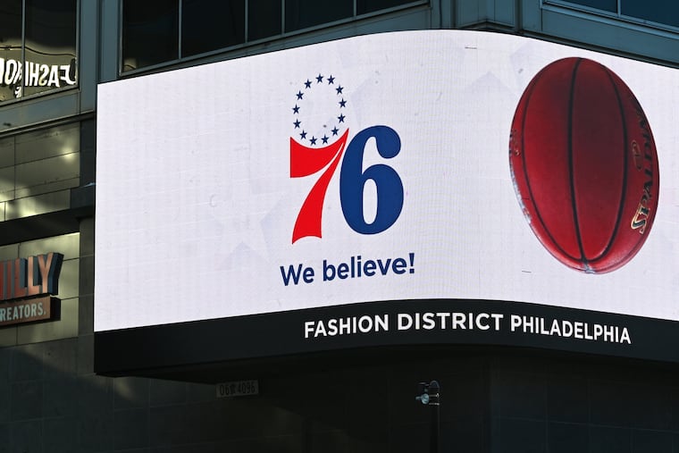 An electronic billboard advertisement outside the Fashion District for the Sixers' proposed arena, 76 Place at Market East.