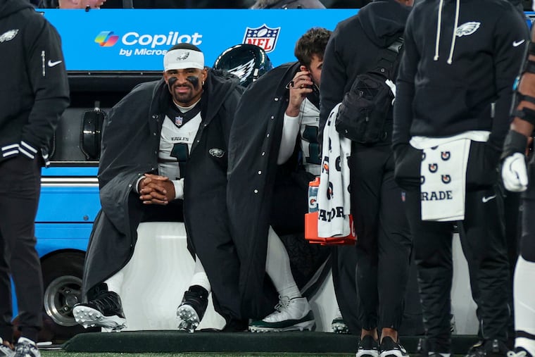 Eagles quarterback Jalen Hurts sits on the bench in the fourth quarter of the Eagles' loss to the Giants earlier this season.