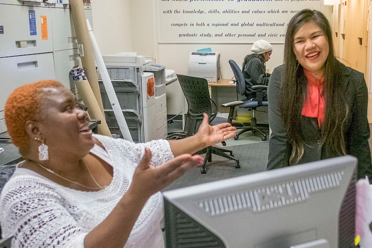 Edilma Evans (left), who works in the College of New Jersey's Educational Opportunity Fund office, with program participant Tu Nguyen.