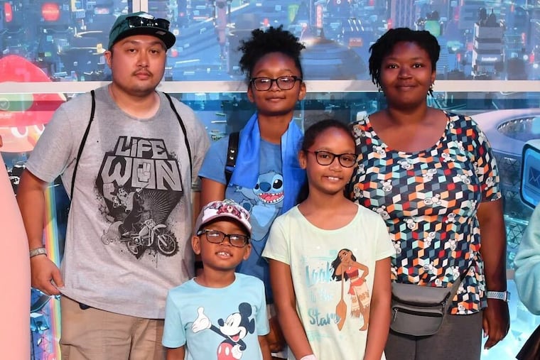 Xuong Le, (left), Britni McLaughlin Le (right) and children Natalya Le (back center), Xavier Le, and Nakayla Le on a recent trip to Walt Disney World. The family's close friends and relatives say they leave behind a lifetime of happy memories.