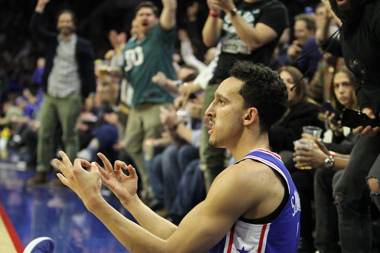Landry Shamet reacts after hitting a three-pointer and falling out of bounds against the Spurs in the fourth quarter.