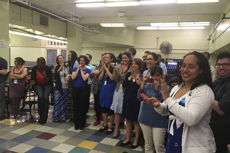 Olney Charter High School staffers learn the results of union vote in the school’s cafeteria. (REGINA MEDINA / DAILY NEWS STAFF)