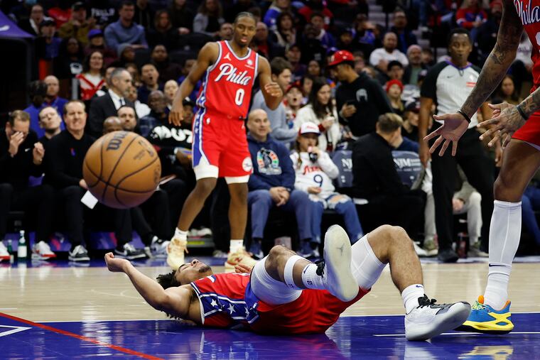Sixers guard Jared McCain gathers himself on the floor after getting fouled against the Indiana Pacers on Friday.