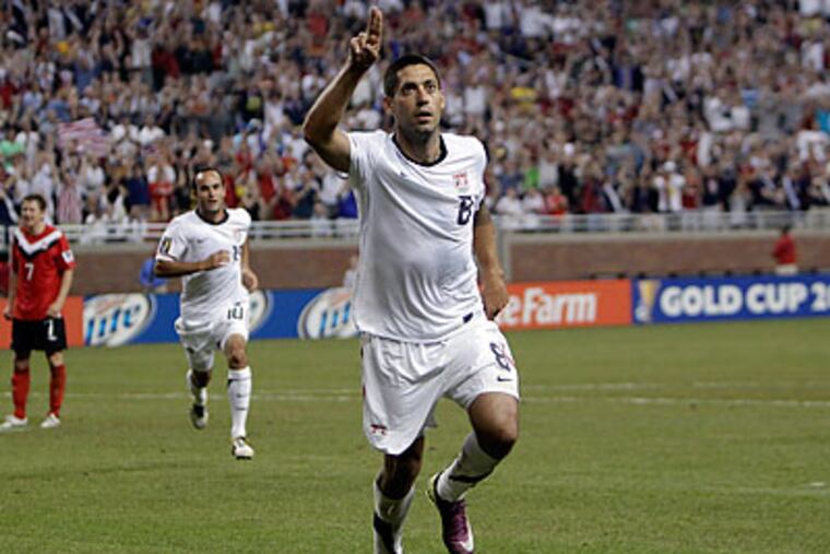 Clint Dempsey celebrates after scoring in the 62nd minute against Canada. (Paul Sancya/AP)