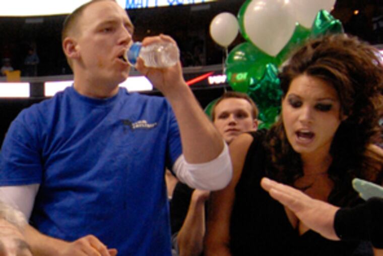 Tiffany Heller (right) cheers Joey Chestnut on in the '07 Wing Bowl.