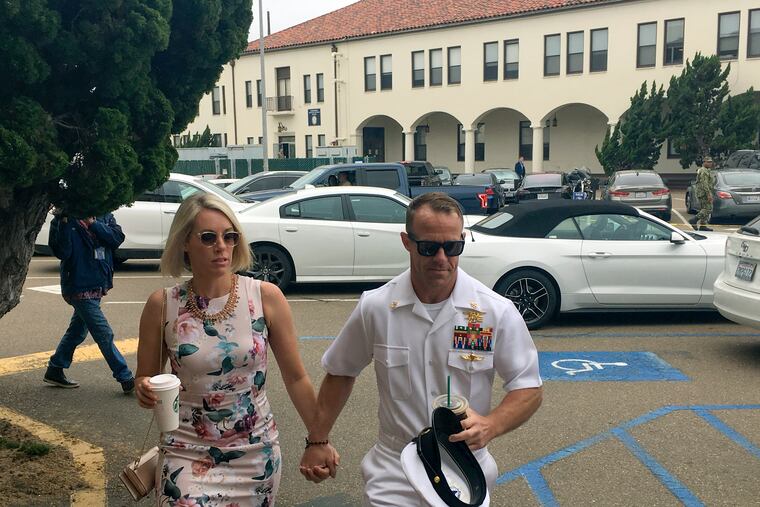 Navy Special Operations Chief Edward Gallagher, right, walks with his wife, Andrea Gallagher, as they arrive to military court on Naval Base San Diego, Thursday, June 20, 2019, in San Diego. More former SEALs were expected to testify on Thursday in the case against Gallagher, who has pleaded not guilty to murder and attempted murder stemming from his 2017 tour of duty in Iraq.
