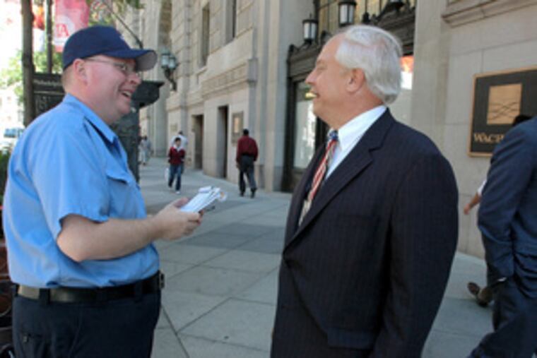 Republican Al Taubenberger (right) chats with John Farley on South Broad Street. If Taubenberger beats Democrat Michael Nutter, he would be the city's first Republican mayor in 60 years.