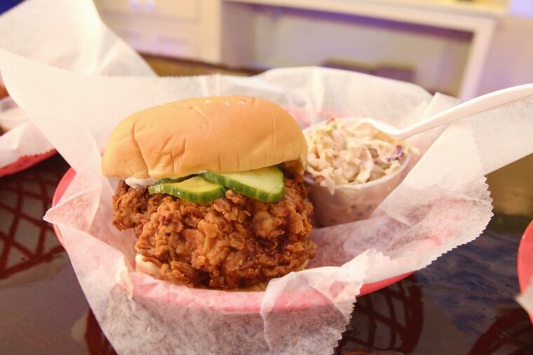 The signature chicken sandwich, served with sauce and coleslaw, at Foghorn, 4213 Ridge Ave.