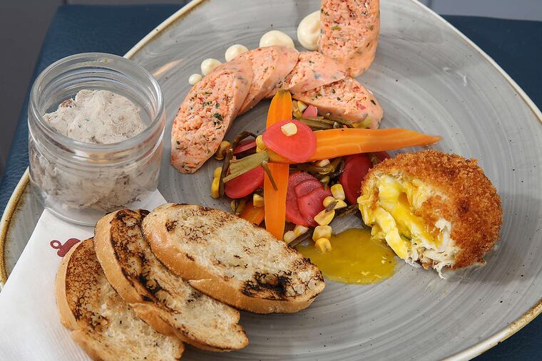 The "Seacuterie" plate at Chesapeake & Maine, with crab cake Scotch egg, lobster sausage, and smoked whitefish paté.