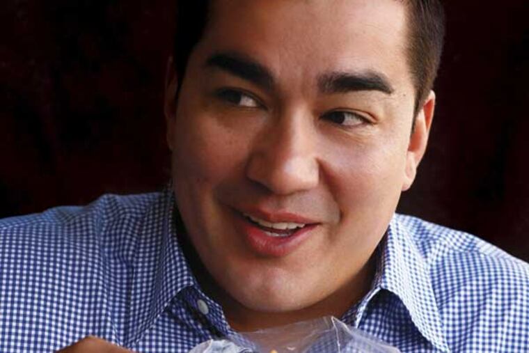 Jose Garces, chowing down.