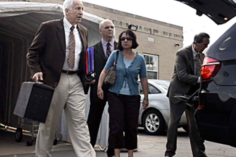 Jerry Sandusky leaves the Centre County Courthouse in Bellefonte on Thursday afternoon following the fourth day of his trial. TOM GRALISH / Staff Photographer