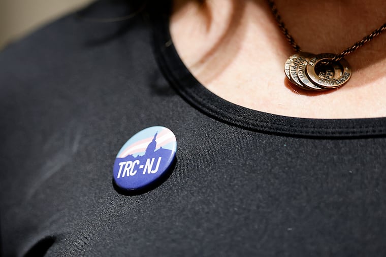 Melissa Firstenberg, a South Jersey transgender woman and LGBTQ+ rights advocate, wears her Transgender Rights Coalition of New Jersey pin as Collingswood adopts a resolution for the Trans Day of Visibility in March.
