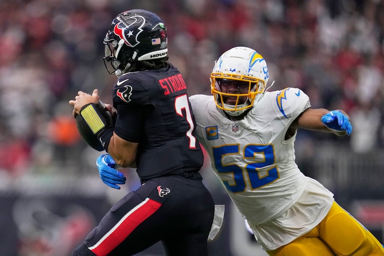 Pro Bowl edge rusher Khalil Mack of the Chargers sacks Texans quarterback C.J. Stroud in a playoff game on Jan. 11.
