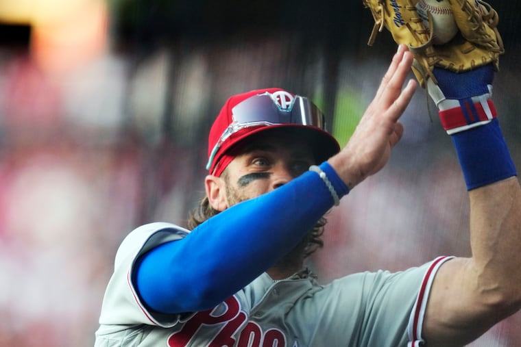 Philadelphia Phillies first baseman Bryce Harper catches a foul ball hit by Cleveland Guardians' Amed Rosario in the third inning Friday.