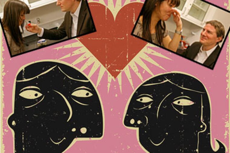 Research assistant Eva Alden smells a vial of men's body odor with neuroscientist Johan Lundstrom. (Akira Suwa / Staff Photographer)