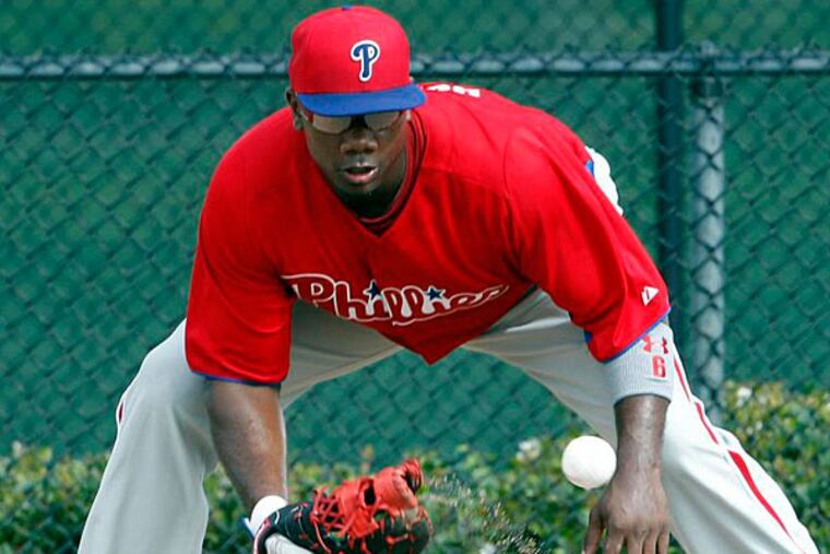 Phillies' Ryan Howard fields a ground ball during Spring Training workouts in Clearwater, FL on Wednesday, February 13, 2013. (Yong Kim/Staff Photographer)