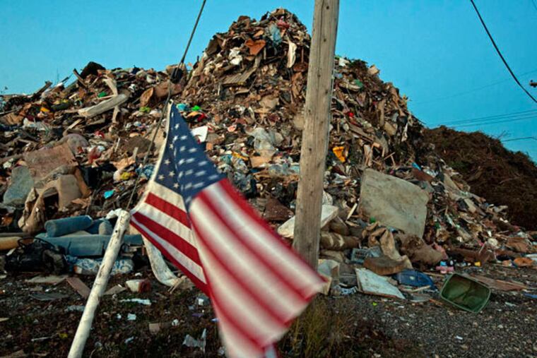 A mountain of debris from houses damaged by Hurricane Sandy awaits removal in Long Branch, N.J. (April Saul / Staff Photographer)