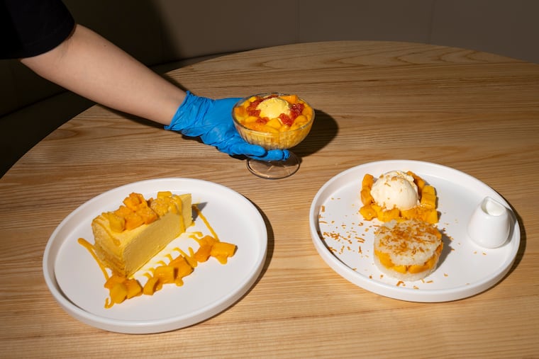 The mango mille crepe cake slice, strawberry mango juice sago and lychee jelly with mango ice cream, and the mango coconut sticky rice ice cream at Mango Mango Dessert in Ardmore.