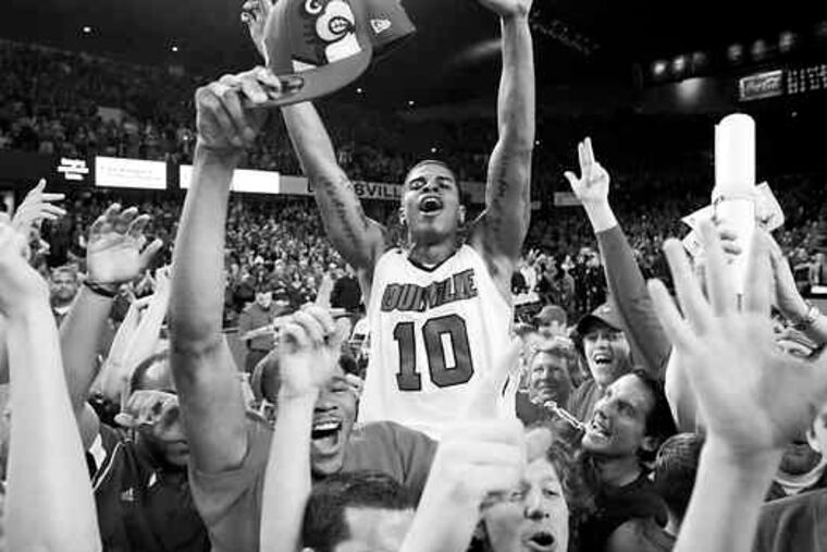 Louisville's Edgar Sosa is carried on the shoulders of fans after his team beat No. 1 Syracuse, 78-68, at home in Kentucky.